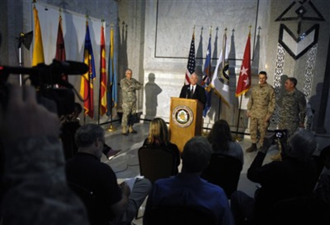 Defense Secretary Robert Gates conducts a press conference after meeting with top generals in Iraq as Gen. George Casey, commander, Multinational Forces-Iraq, looks on, Dec. 20, 2006.  