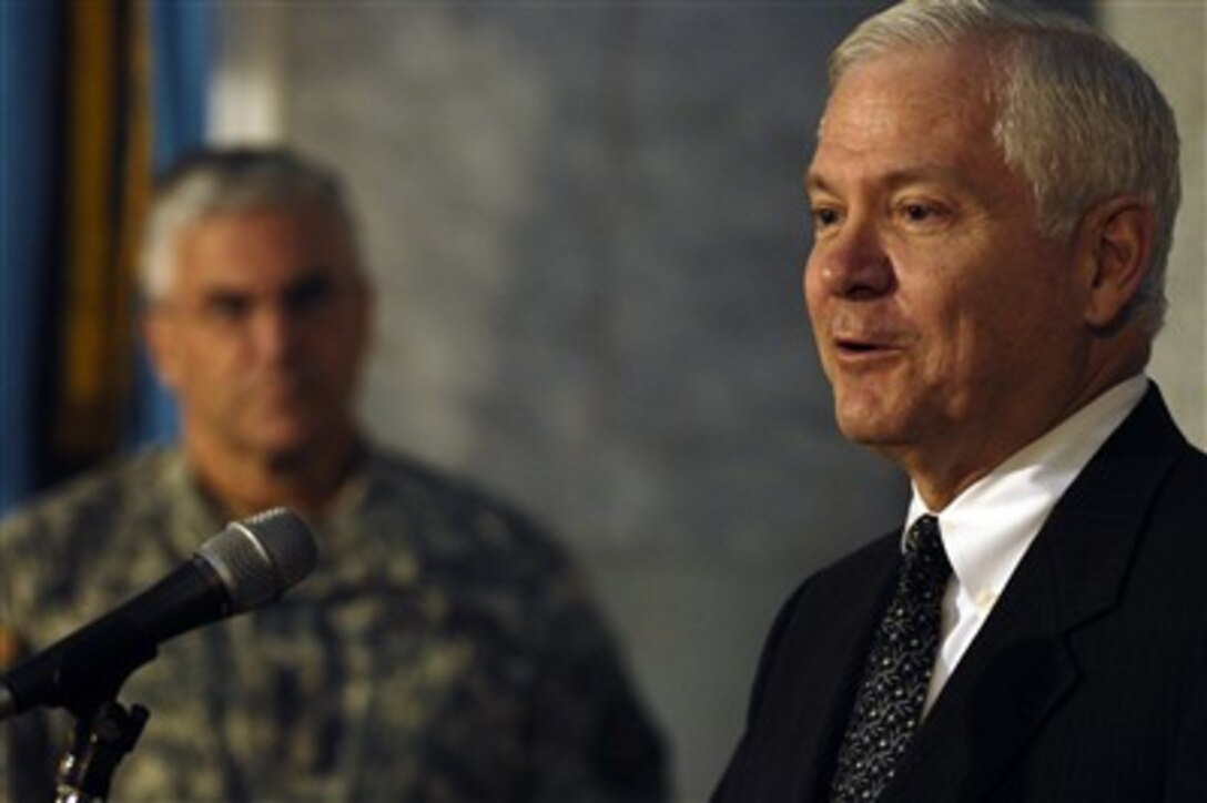 Defense Secretary Robert Gates conducts a press conference after meeting with top generals in Iraq as Gen. George Casey, commander Multinational Forces-Iraq, looks on, Dec. 20, 2006.  
