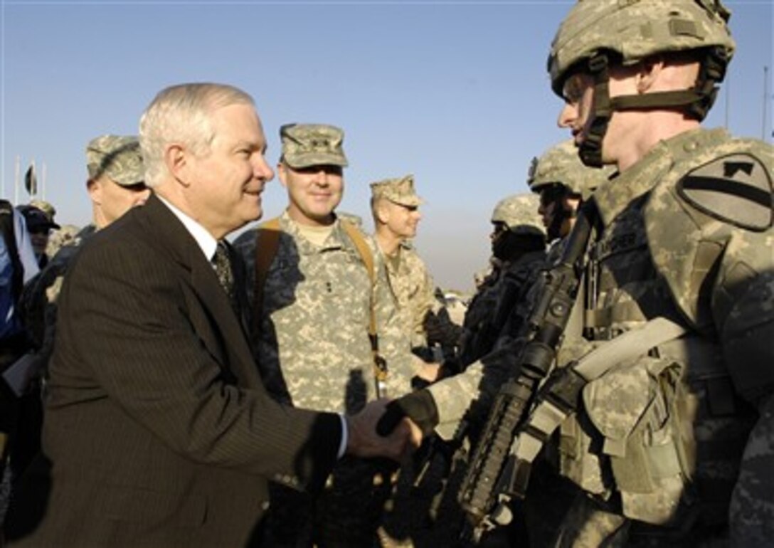 Defense Secretary Robert Gates meets with troops from the 1st Cavalry Division during a visit to Baghdad, Iraq, Dec. 20, 2006.