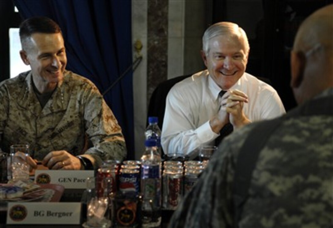 Defense Secretary Robert Gates and U.S. Marine Gen. Peter Pace, chairman of the Joint Chiefs of Staff, meet with Lt. Gen. Ray Odierno, commander multinational corps-Iraq, at Al Faw palace during a visit to Baghdad, Iraq, Dec. 20, 2006.