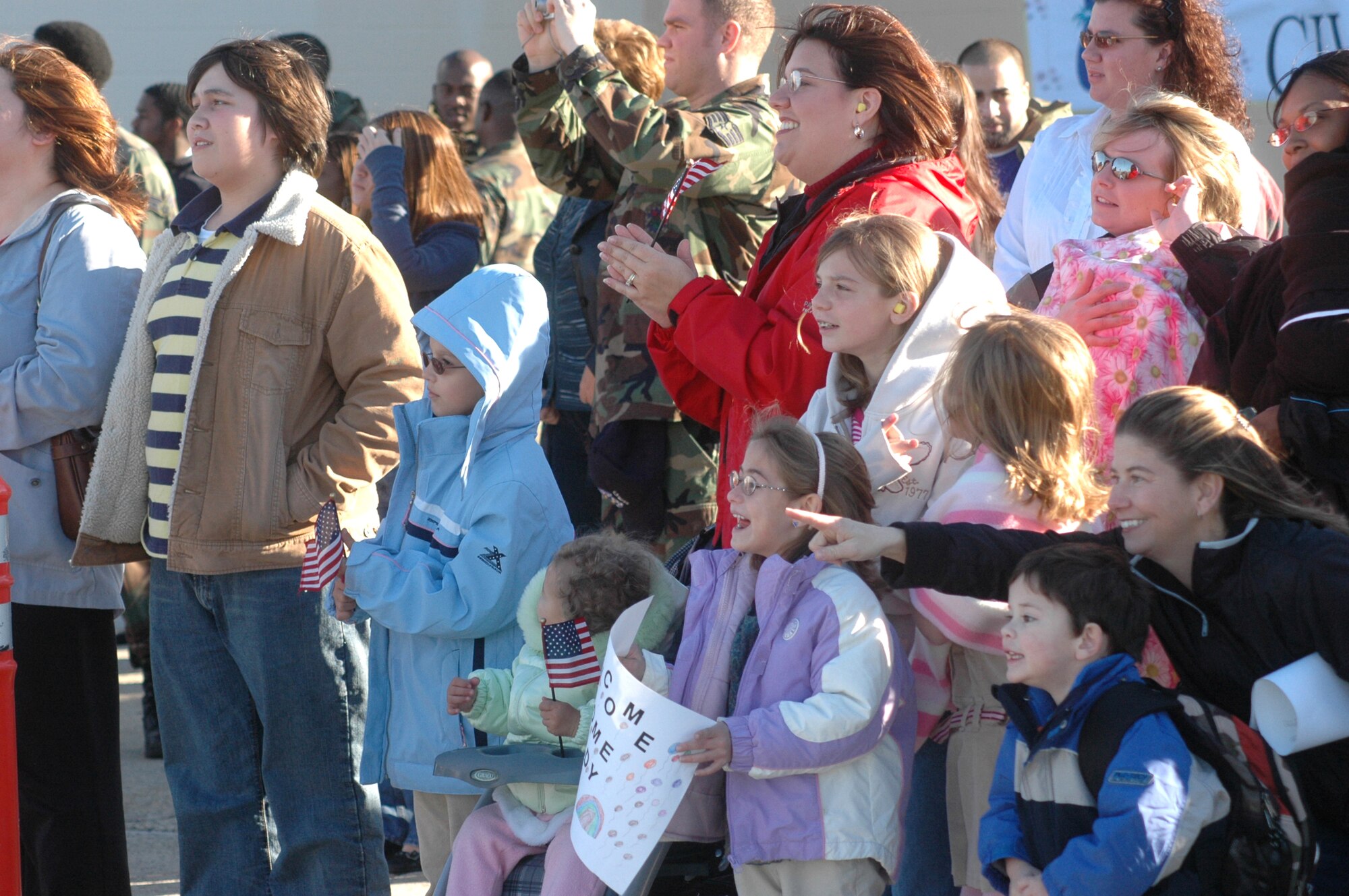 Family and friends of the returning Airmen show their excitement as the aircraft comes into view.
U.S. Air Force photo by SUE SAPP