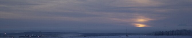 EIELSON AIR FORCE BASE, Alaska -- The sun rises over the flightline on Dec 21 which marks the Winter Solstice, the shortest day of the year. At Eielson Air Force Base the sun rose at 1052 and set at 1441 today resulting in a total of 3 hours and 49 minutes from sun up to sun down. This night will be considerably darker due to the moon being below the horizon all night, resulting in 0% moonlight illumination. 
(U.S. Air Force Photo by Staff Sergeant John Gott.)