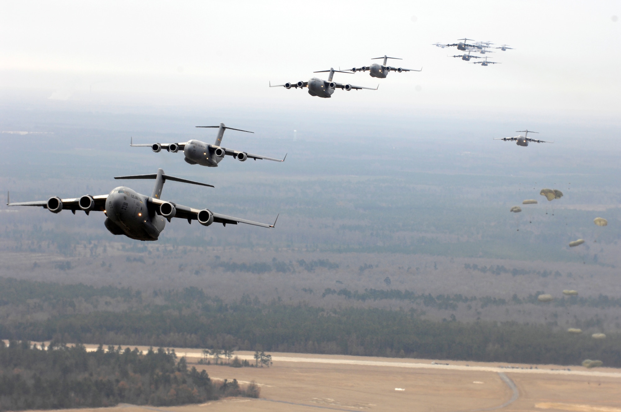 Twenty U.S. Air Force C-17 Globemaster IIIs fly over Charleston, S.C., Dec. 21, 2006.  The C-17s, assigned to the 437th and 315th Airlift Wings at Charleston Air Force Base, S.C., were part of the largest C-17 formation in history from a single base and demonstrated the strategic airdrop capability of the U.S. Air Force. (U.S. Air Force photo by Senior Airman Richard W. Rose Jr.)
