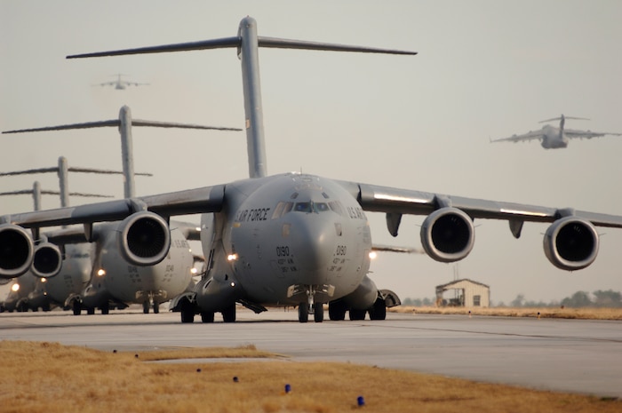 Twenty C-17 globemaster IIIs, while at Charleston Air Force Base, S.C., taxi prior to take-off, Dec. 21, 2006. Team Charleston launched a record-breaking formation of C-17 aircraft; the largest formation of C-17's to take flight from a single base. (U.S. Air Force photo by Staff Sgt. Marie Cassetty)