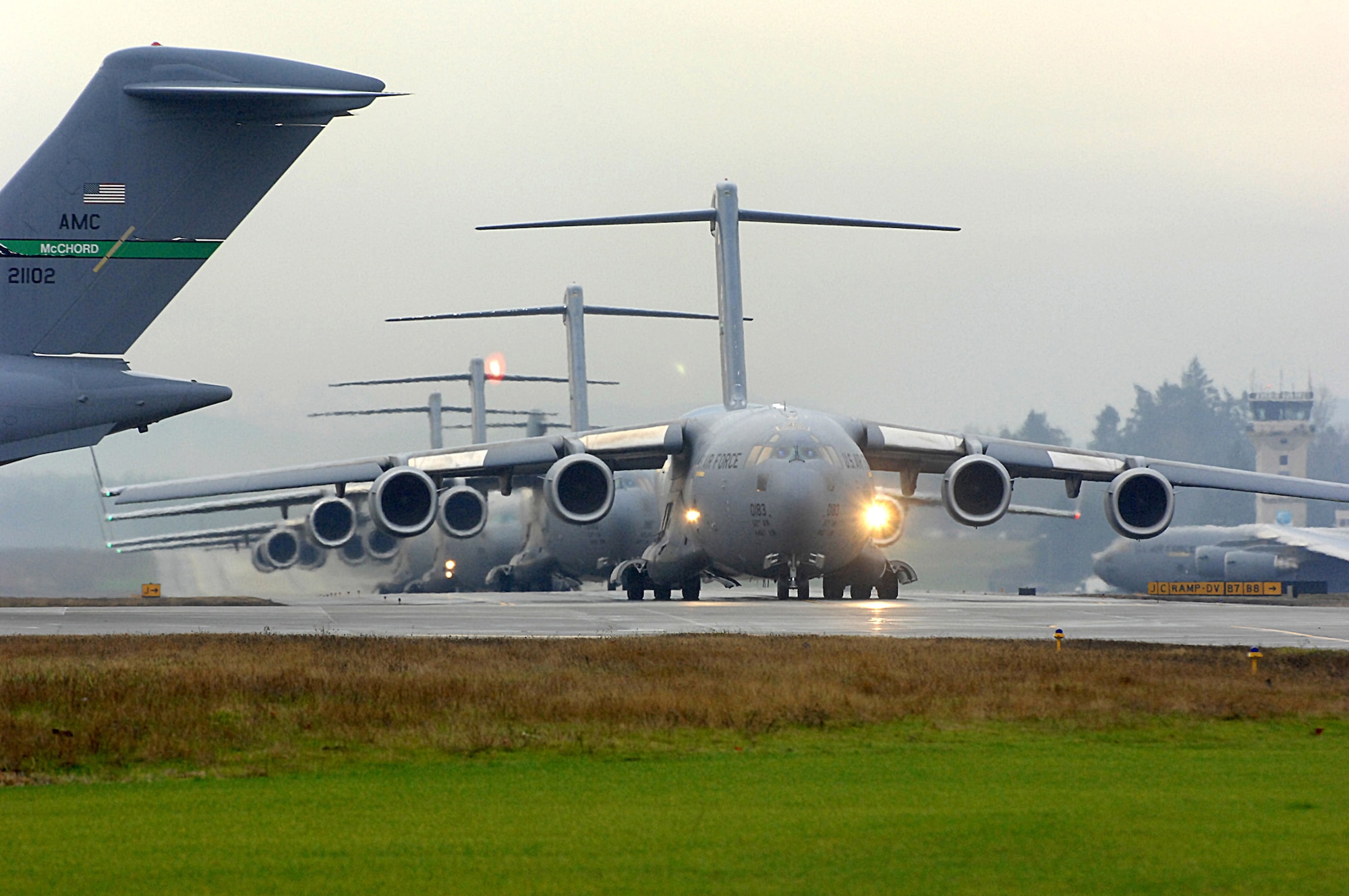 Six C-17 Globemaster III's prepare to launch as part of a formation training exercise Dec. 20 from McChord Air Force Base, Wash.  The exercise consisted of 10 aircraft and was designed to test all the organizations and different aspects of the mission that have to come together to facilitate launching, executing and recovering a large formation of C-17's in a short period of time. (U.S. Air Force photo/Abner Guzman)