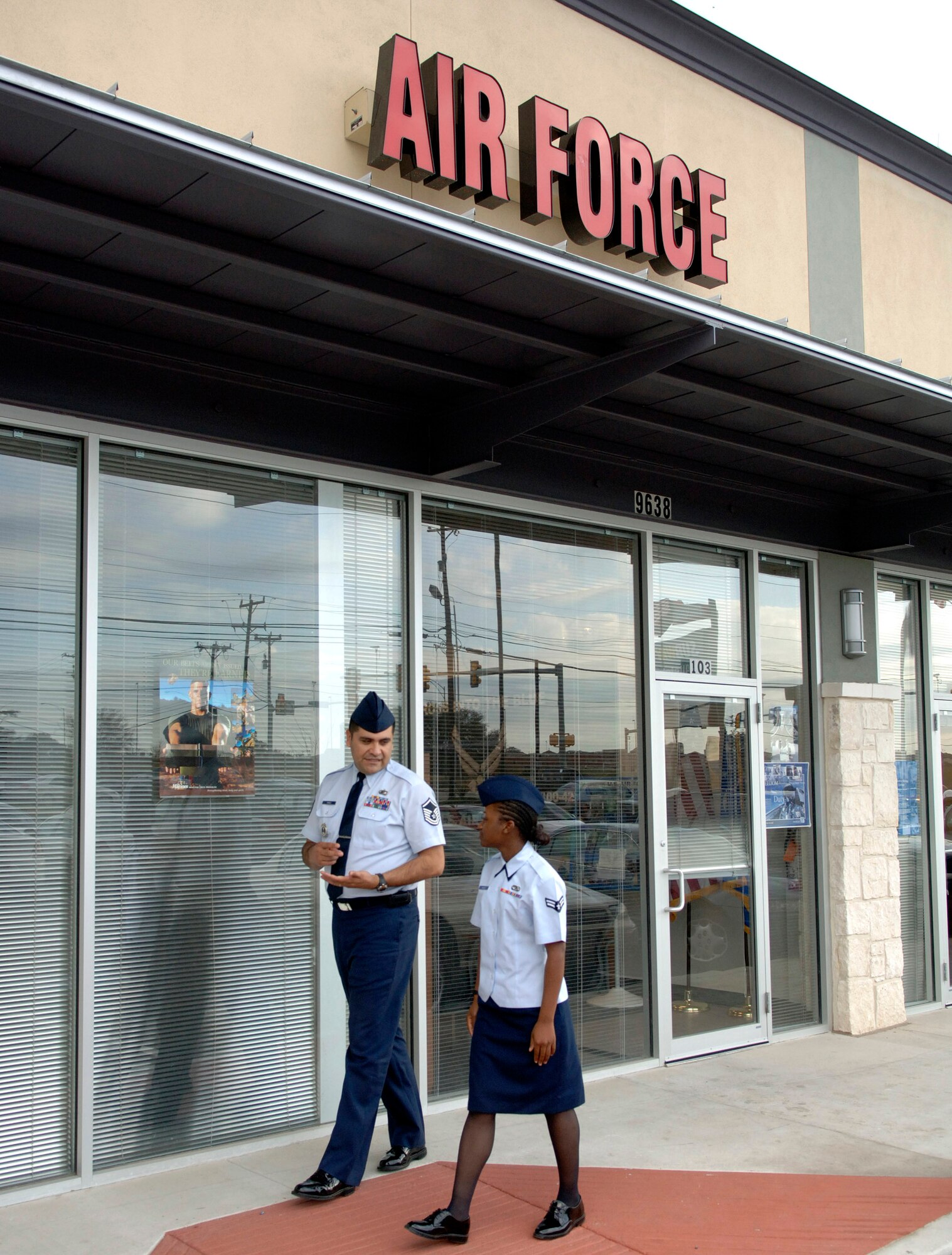 Air Force recruiters like San Antonio recruiter Master Sgt. Ruben Perez, shown here talking to Airman 1st Class Stephanie Miller, sometimes find themselves going above and beyond because they work in the local community.  Two recruiters in Boise, Idaho, recently had the opportunity to provide some comfort to a distraught visitor who happened to wander into their office.  (U.S. Air Force photo/Tech. Sgt. Larry Simmons) 