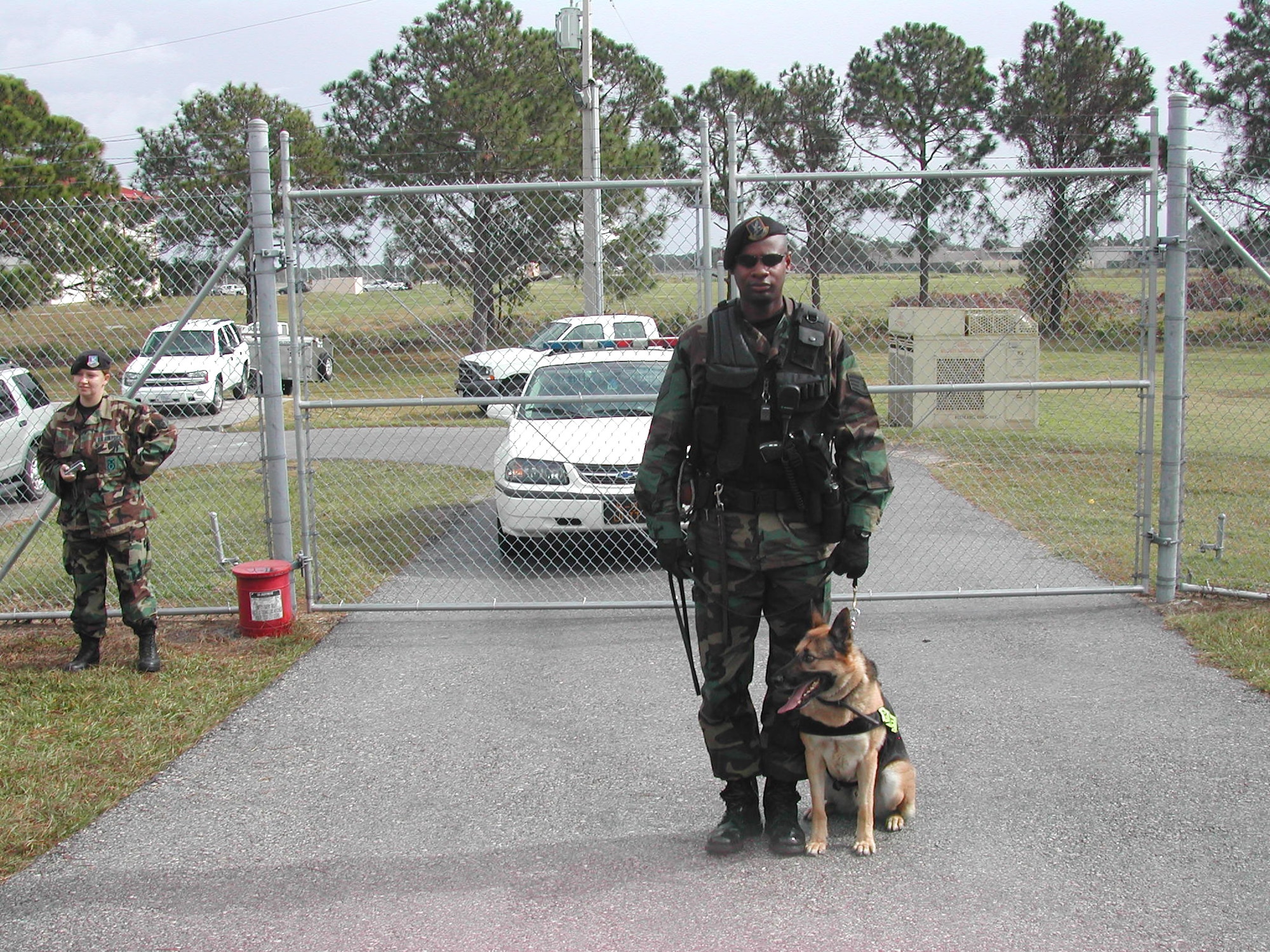 Staff Sgt. Mario Williams, a military working dog handler with the 6th Security Forces Squadron at MacDill Air Force Base, Fla., will spend Christmas patrolling the base with his German Sheppard, Jago. (U.S. Air Force photo)
