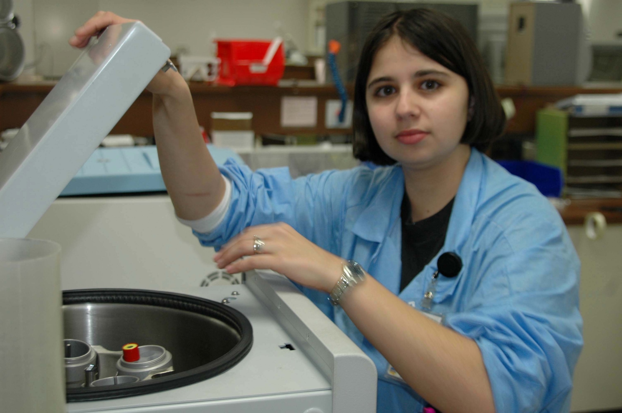 Airman 1st Class Danielle Woodcock loads a vial of blood into a centrifuge, a device that separates materials of different density.  Airman Woodcock is a medical laboratory technician assigned to the 28th Medical Support Squadron at Ellsworth Air Force Base, S.D.  The lab recently was accredited by the College of American Pathologists  (U.S. Air Force photo/Airman Nathan Riley)