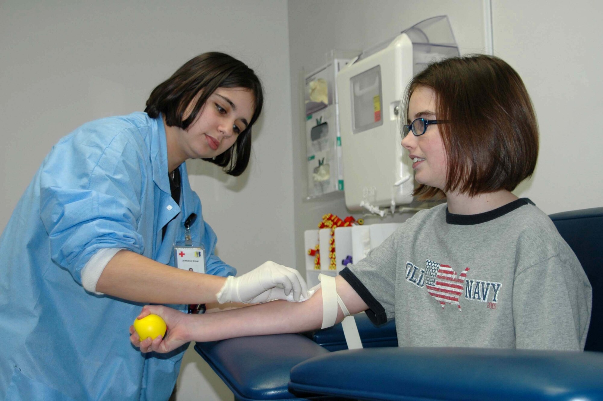 Airman 1st Class Danielle Woodcock prepares to draw some blood Dec. 19 from Donna Haugh, age 10, daughter of Master Sgt. and Mrs. Peter Haugh.  Airman Woodcock is a medical laboratory technician assigned to the 28th Medical Support Squadron at Ellsworth Air Force Base, S.D.  The lab recently was accredited by the College of American Pathologists  (U.S. Air Force photo/Airman Nathan Riley)