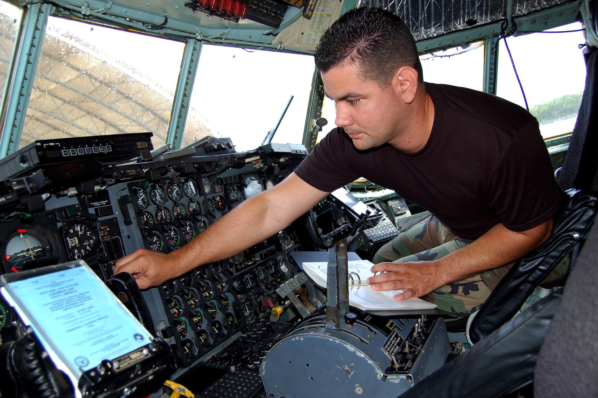 Senior Airman Michael Ortega checks the guages and autopilot on a C-130 Hercules Dec. 15 at Mu?iz Air National Guard Base, Puerto Rico. The avionics instruments and flight controls specialist with the 156th Aircraft Maintenance Squadron, from Toa Alta, Puerto Rico, helps maintain the Air Force's oldest C-130s. (U.S. Air Force photo/Louis A. Arana-Barradas)