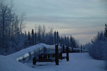 EIELSON AIR FORCE BASE, Alaska -- The sun rises over the Alaska Pipeline here on Dec 21 which marks the Winter Solstice, the shortest day of the year. At Eielson Air Force Base the sun rose at 1052 and set at 1441 today resulting in a total of 3 hours and 49 minutes from sun up to sun down. This night will be extra dark due to the moon being completely below the horizon all day resulting in 0% moonlight illumination.
(U.S. Air Force Photo by Staff Sgt Joshua Strang)