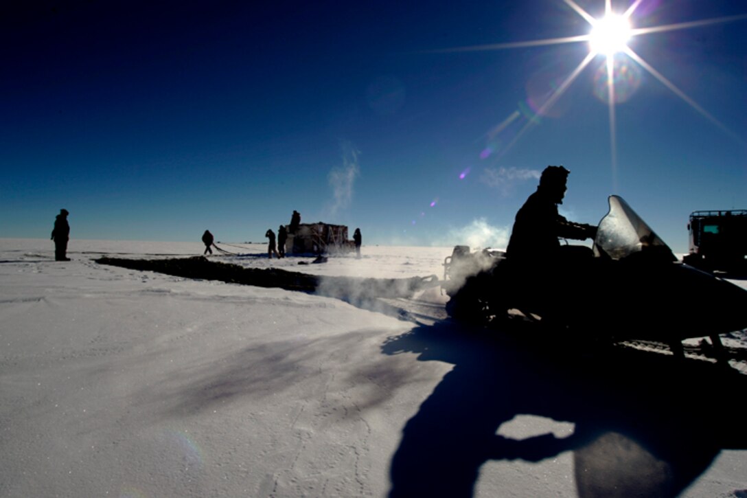 Members of the National Science Foundation wintering in the Antarctic retrieve supplies airdropped by a C-17 Globemaster III Dec. 20.  Airmen from the 62nd and 446th Airlift Wings at McChord Air Force Base, Wash., delivered 70 tons of supplies to the team. The mission was a "proof of concept" flight for the C-17 and was part of Joint Task Force-Support Forces Antarctica's Operation Deep Freeze.  (U.S. Air Force photo/Lt. Col. James McGann)