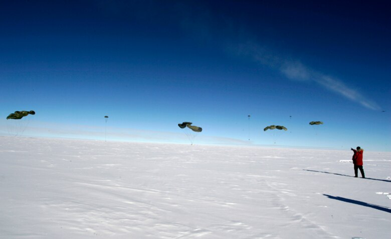 Pallets of cargo fall to the ice Dec. 20 during the first C-17 Globemaster III airdrop to the South Pole.  Airmen from the 62nd and 446th Airlift Wings at McChord Air Force Base, Wash., delivered 70 tons of supplies to the National Science Foundation team wintering there. The mission was a "proof of concept" flight for the C-17 and was part of Joint Task Force-Support Forces Antarctica's Operation Deep Freeze.  (Raytheon Inc. photo/Forest Banks)