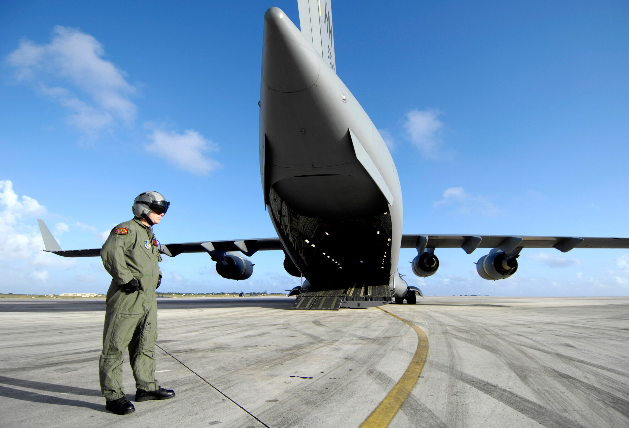 Staff Sgt. Allen Culbreth waits for his C-17 Globemaster III to launch on an upcoming airdrop mission Dec. 14 at Andersen Air Force Base, Guam. The C-17 from Hickam Air Force Base, Hawaii, is conducting airdrop training at Andersen AFB. Sergeant Culbreth is a loadmaster with the 535th Airlift Squadron. (U.S. Air Force photo/Tech. Sgt. Shane A. Cuomo)