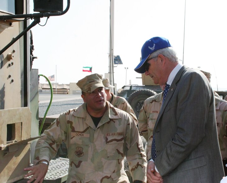 Tech. Sgt. Esteban Ochoa, deployed from the 28th Logistics Readiness Squadron at Ellsworth Air Force Base, S.D., gives an operational brief to the Michael W. Wynne, secretary of the Air Force. Sergeant Ochoa briefed the secretary on his last day of his deployment to Southwest Asia with the 70th Medium Truck Detachment, 586 Expeditionary Logisitics Readiness Squadron. (U.S. Air Force photo/Maj. Joe Mercurio) 