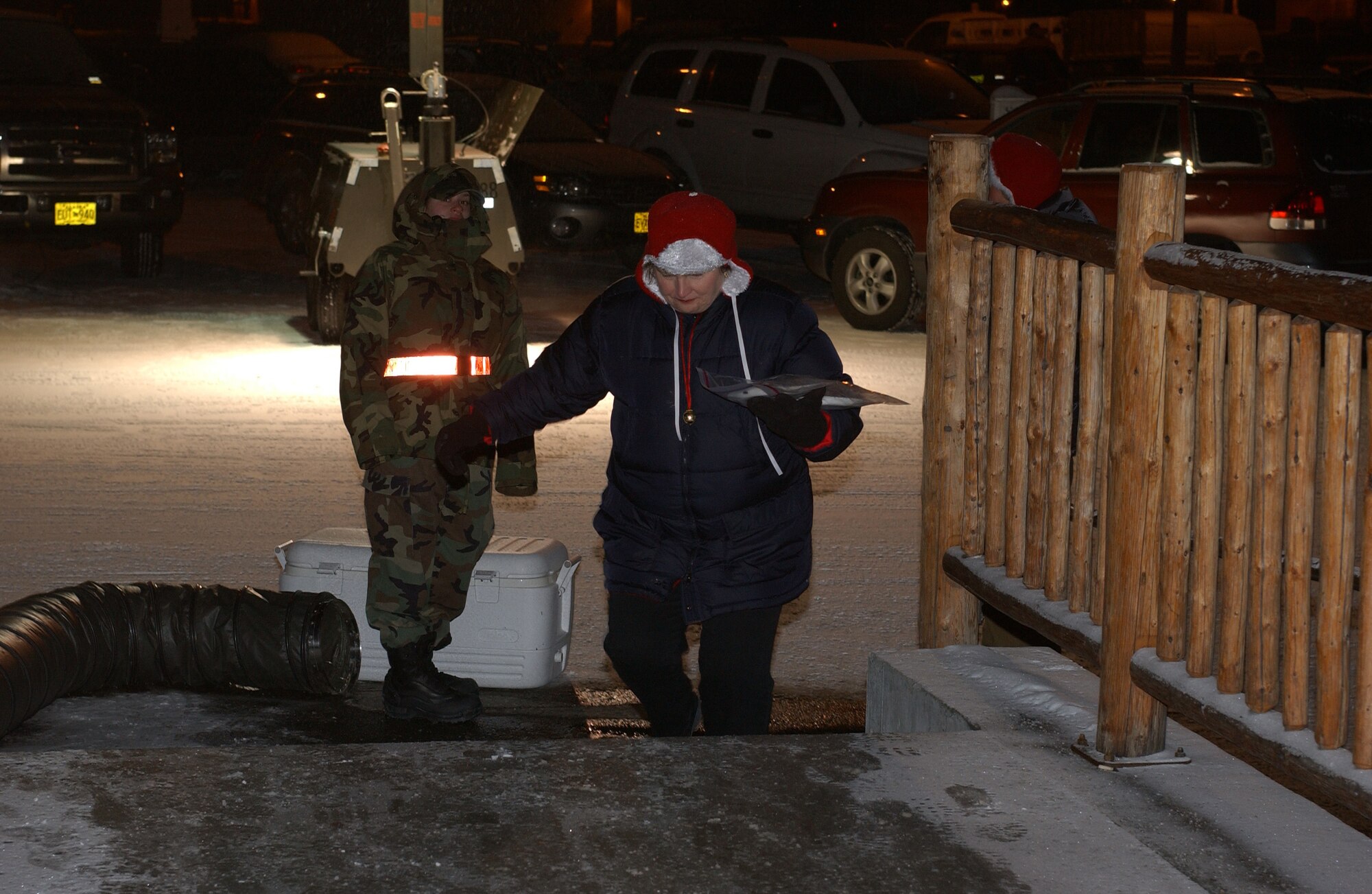 EIELSON AIR FORCE BASE, Alaska -- Susie Crosby wife of Col Crosby hands out cookies in for the annual Operation Cookie Crunch on Dec. 15. Hundreds of dozens of cookies are packeaged up each year and delivered to families of deployed airmen and single airmen stationed on Eielson AFB. The event is not unique to Eielson, but more of an Air Force tradition.
(U.S. Air Force Photo by Senior Airman Anthony Nelson Jr)