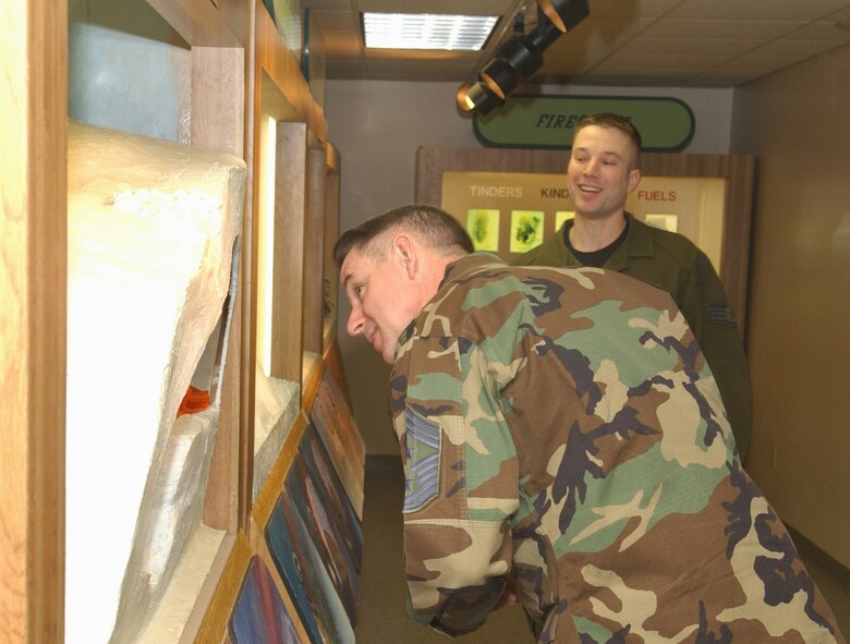EIELSON AIR FORCE BASE, Alaska -- 11th Air Force Command Chief Master Sgt David Andrews observes a display of snow shelters made in Artic Survival Training on Dec 19.  While visiting Eielson, Chief Andrews stopped by Artic Survival School for a tour to see what kind of program they run and the variety of severe conditions they expose themselves to.
(U.S. Air Force photo by Airman Christopher Griffin.)