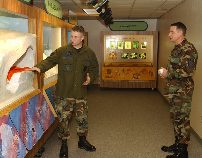 EIELSON AIR FORCE BASE, Alaska -- Staff Sergeant Jason Clapper an instructor of the Artic Survival School explains to 11th Air Force Command Chief Master Sgt David Andrews one of the many methods of creating shelter on Dec 19. While visiting Eielson, Chief Andrews stopped by Artic Survival School for a tour to see what kind of program they run and the variety of severe conditions they expose themselves to.
(U.S. Air Force photo by Airman Christopher Griffin.)