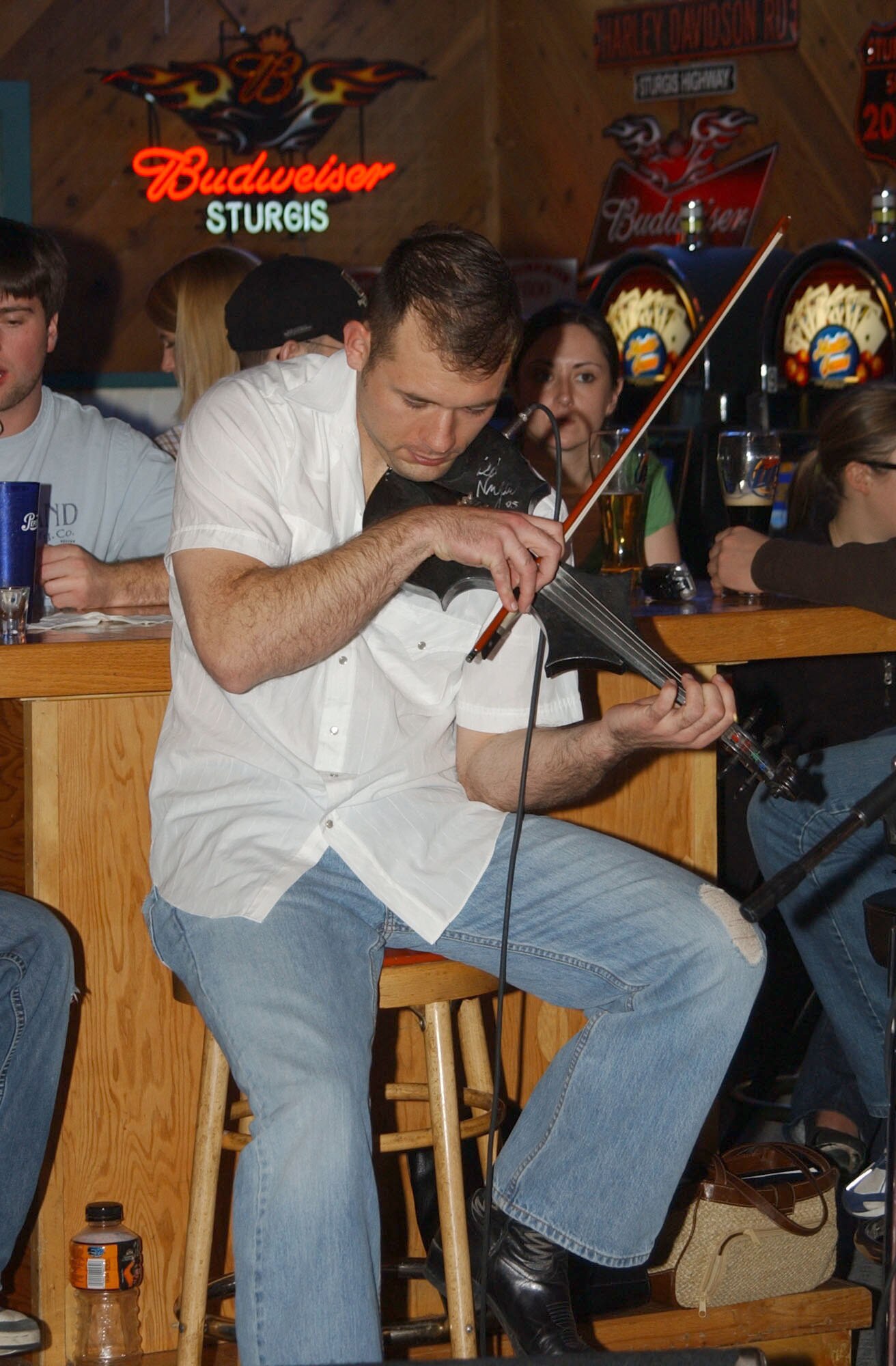 Capt. Alex Ruiz, a missileer with the 10th Missile Squadron, plays with the musical group the "Thrill-billies" at the Sting sports bar Dec. 14. Capt. Ruiz will be leaving Malmstrom to be the tour director for and a performer with the Air Force Tops-In-Blue 2007 troupe.