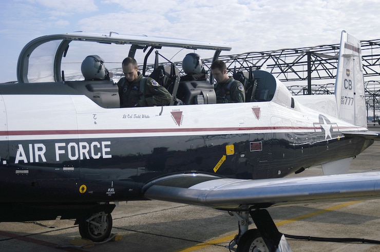 Specialized undergraduate pilot training student 2nd Lt. Rocky Harrisberger (left) and instructor pilot 1st Lt. Mike Glass prepare to fly the first T-6A Texan II student training sortie Dec. 15. Columbus Air Force Base is in the process of phasing of the aging T-37 Tweet for the newer, more efficient T-6. (USAF photo by 2nd Lt. Kristin Hollrith)