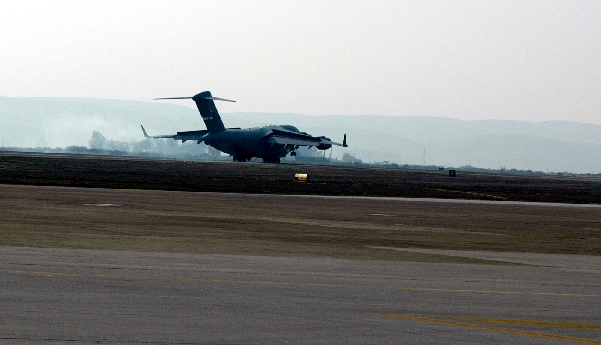 The "Spirit of the Golden Gate" executes a perfect landing as it arrives on the Travis flightline Dec. 20. Maj. Gen. Allan Poulin, Air Force Reserve Command vice commander, piloted the aircraft.  (U.S. Air Force photo by Staff Sgt. Candy Knight)