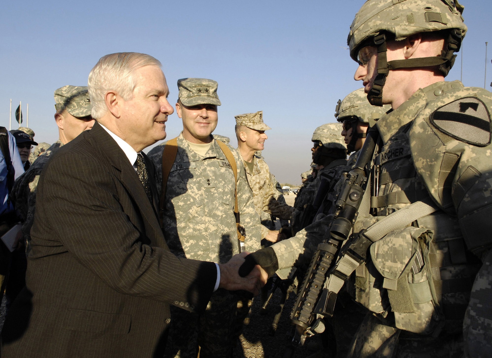 Secretary of Defense Robert M. Gates shakes hands with a U.S. Army Soldier from the 1st Cavalry Division in Baghdad, Iraq, Dec. 20. Secretary Gates is in Iraq to meet with deployed troops, military leaders and key Iraqi government officials to help him assess the current situation and to prepare for the future. (DOD photo/Cherie A. Thurlby)