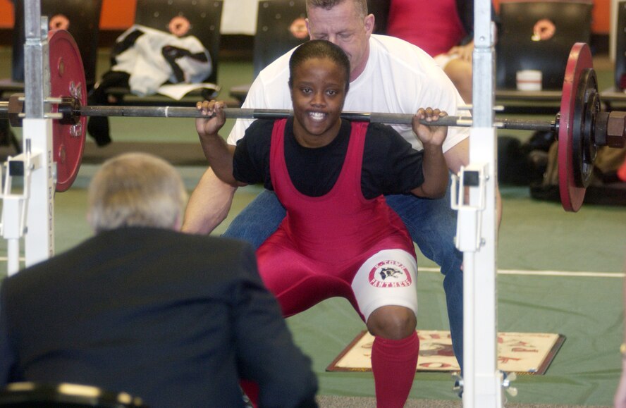 Kaiserslautern’s Regina Simpson lifts 100 kilograms or 220.50 lbs in the third and final round of the squat event Dec. 16 at the U.S. Army Garrison Kaiserslautern’s Power Lifting Meet at the gym on Landstuhl Regional Medical Center. This was Simpson’s first power lifting tournament, and she lifted a total of 282.5 kilograms or 622.80 pounds to win the Overall Female Lifter title.