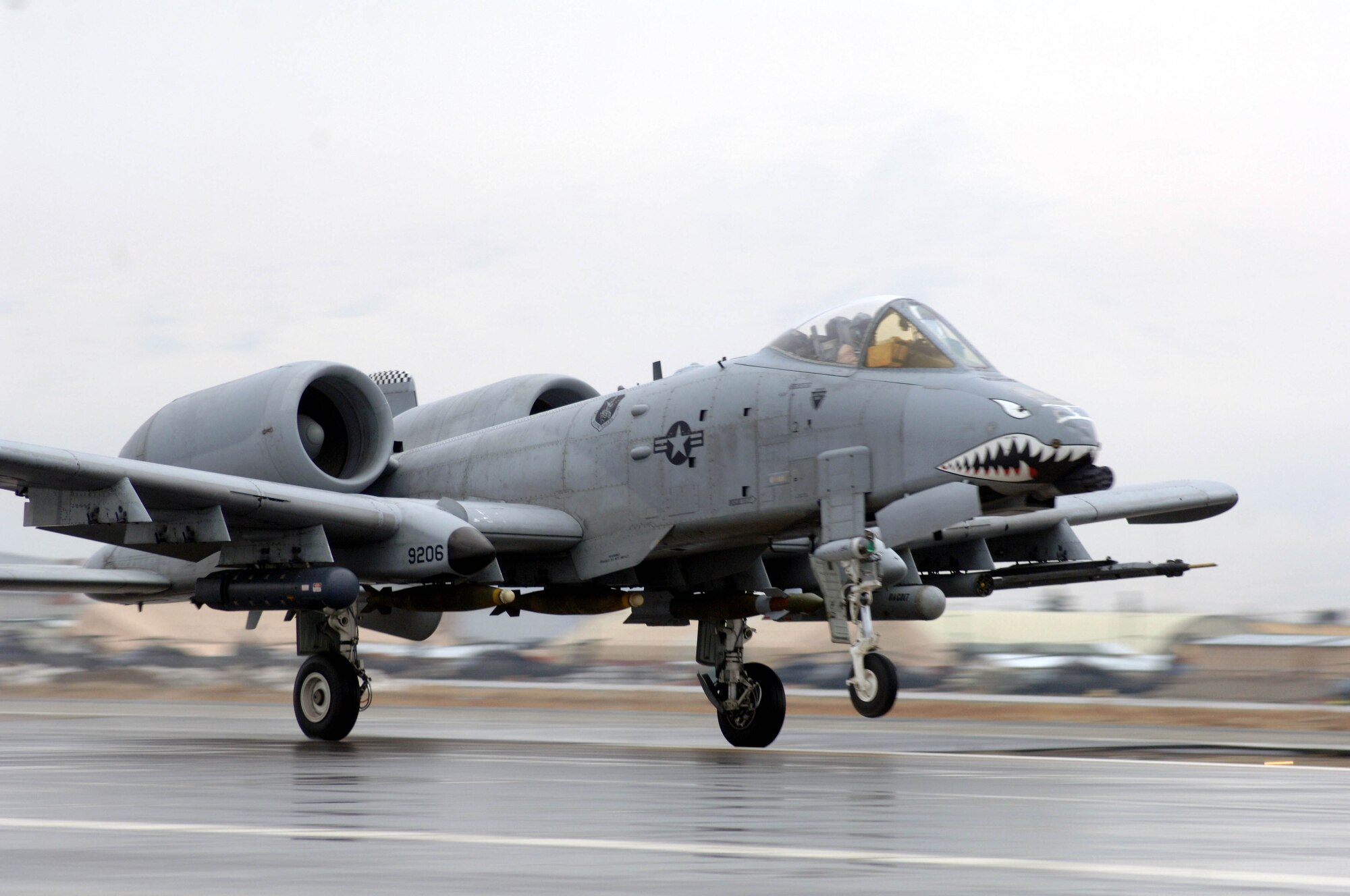 An A-10 Thunderbolt II assigned to the 455th Air Expeditionary Wing lifts off the new runway opened Dec. 20. The new runway is 2000 feet longer than the previous runway and can support all of the aircraft in the U.S. inventory. (U.S. Air Force photo/Tech. Sgt. Joseph Kapinos)