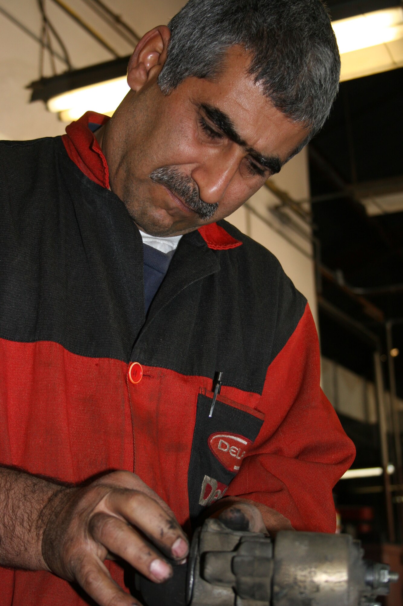 Abdullah Seudan, 39th Services Squadron auto hobby shop mechanic, works on a vehicle starter at the hobby shop. With winter and travel season here base members are encouraged to have their vehicle checked before making a long trip. (U.S. Air Force photo by Tech. Sgt. Brian Jones)