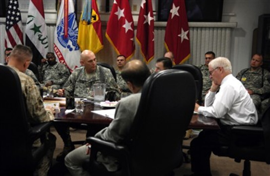 Secretary of Defense Robert M. Gates (right) takes notes during a briefing with commanders from Multinational Division-Baghdad at Al Faw Palace in Baghdad, Iraq, on Dec. 20, 2006.  Gates, along with Chairman of the Joint Chiefs of Staff Gen. Peter Pace, U.S. Marine Corps, is in Iraq to meet with Iraqi leaders, Army Gen. John Abizaid, commander of U.S. Central Command and Army Gen. George Casey, commander Multinational Forces-Iraq, to discuss the way ahead in Iraq.  