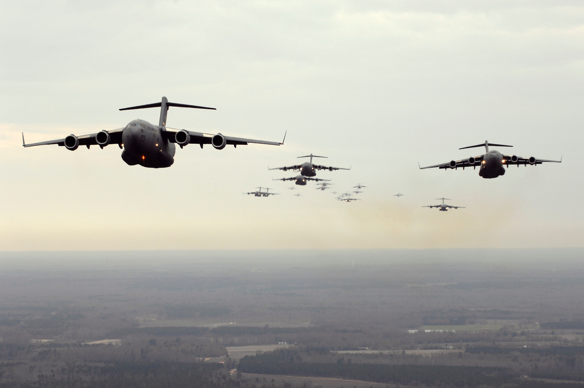 Twenty C-17 Globemaster IIIs participate in a Large Formation Exercise Dec. 21 over the coast of Charleston, S.C. The C-17s, assigned to the 437th and 315th Airlift Wings at Charleston AFB, were part of the largest formation in history from a single base and demonstrated the strategic airdrop capability of the Air Force. (U.S. Air Force photo/Master Sgt. Andy Dunaway)
