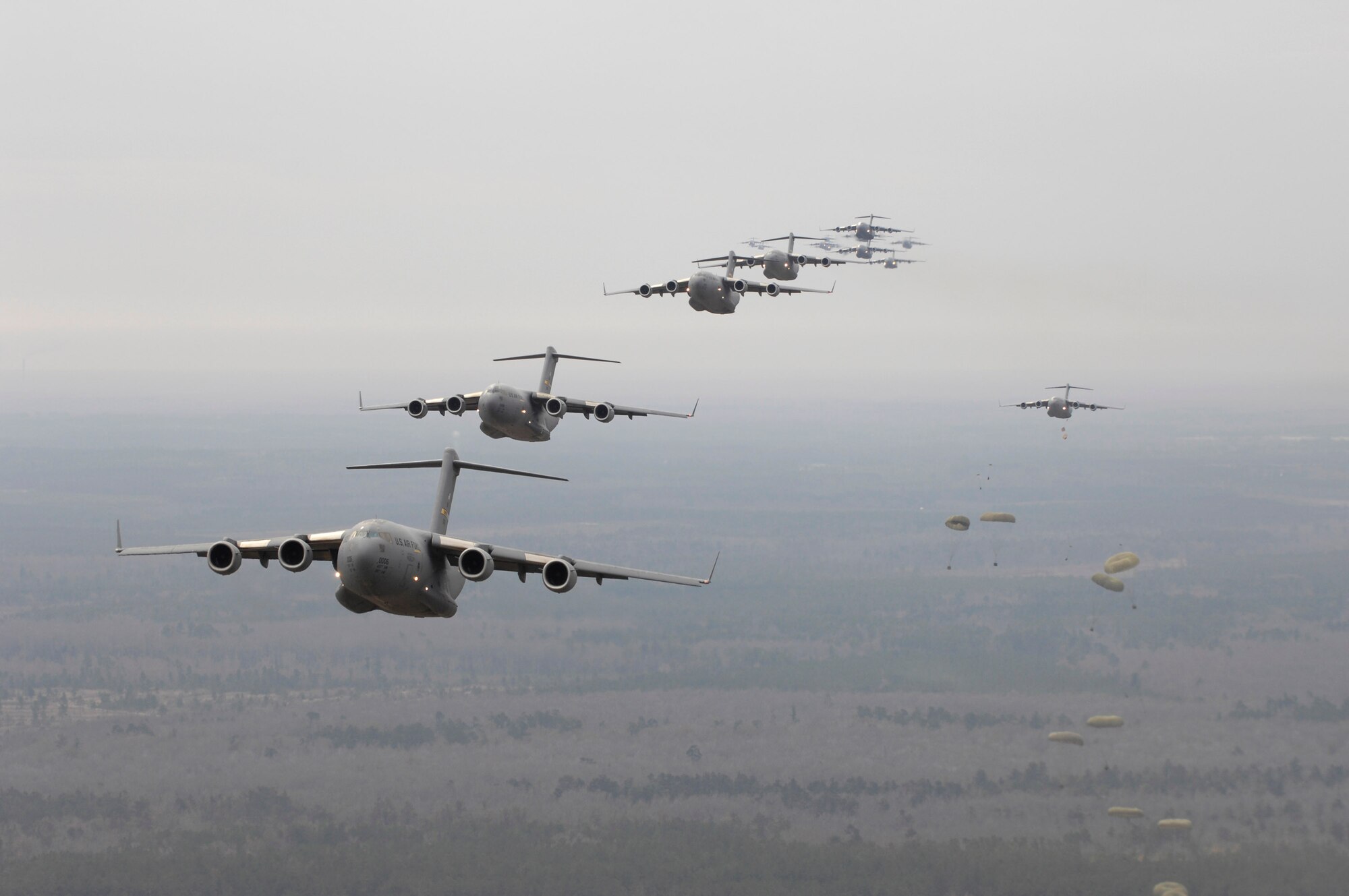 Twenty C-17 Globemaster IIIs participate in the Large Formation Exercise Dec. 21 over the coast of Charleston, S.C. The C-17s, assigned to the 437th and 315th Airlift Wings at Charleston AFB, were part of the largest formation in history from a single base and demonstrated the strategic airdrop capability of the Air Force. (U.S. Air Force photo/Master Sgt. Andy Dunaway)