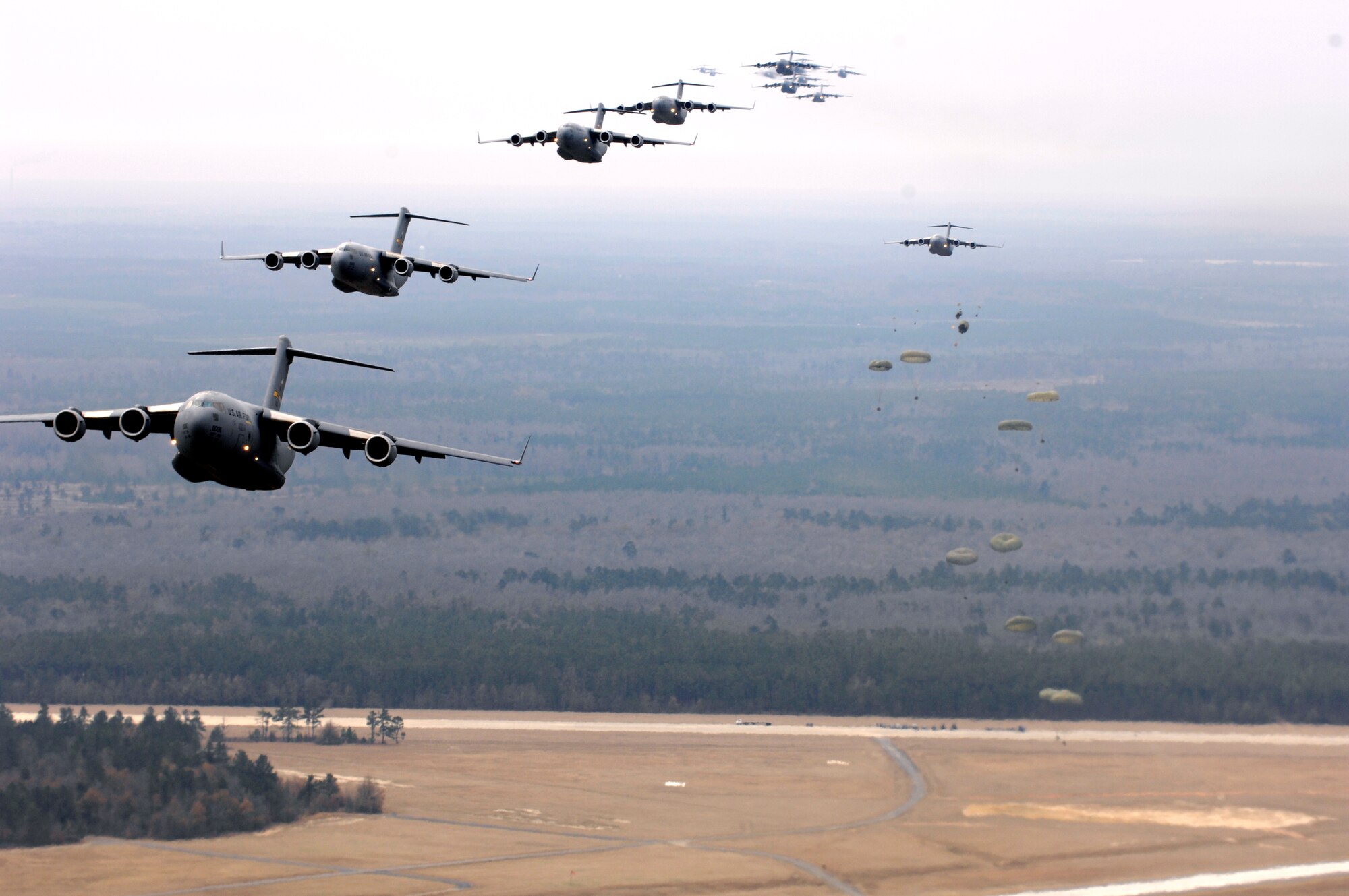 Several C-17 Globemaster IIIs fly as part of a 20-ship formation Dec. 21 over South Carolina. The C-17s, assigned to the 437th and 315th Airlift Wings at Charleston AFB,  were part of the largest formation in history from a single base and demonstrated the strategic airdrop capability of the Air Force. (U.S. Air Force photo)