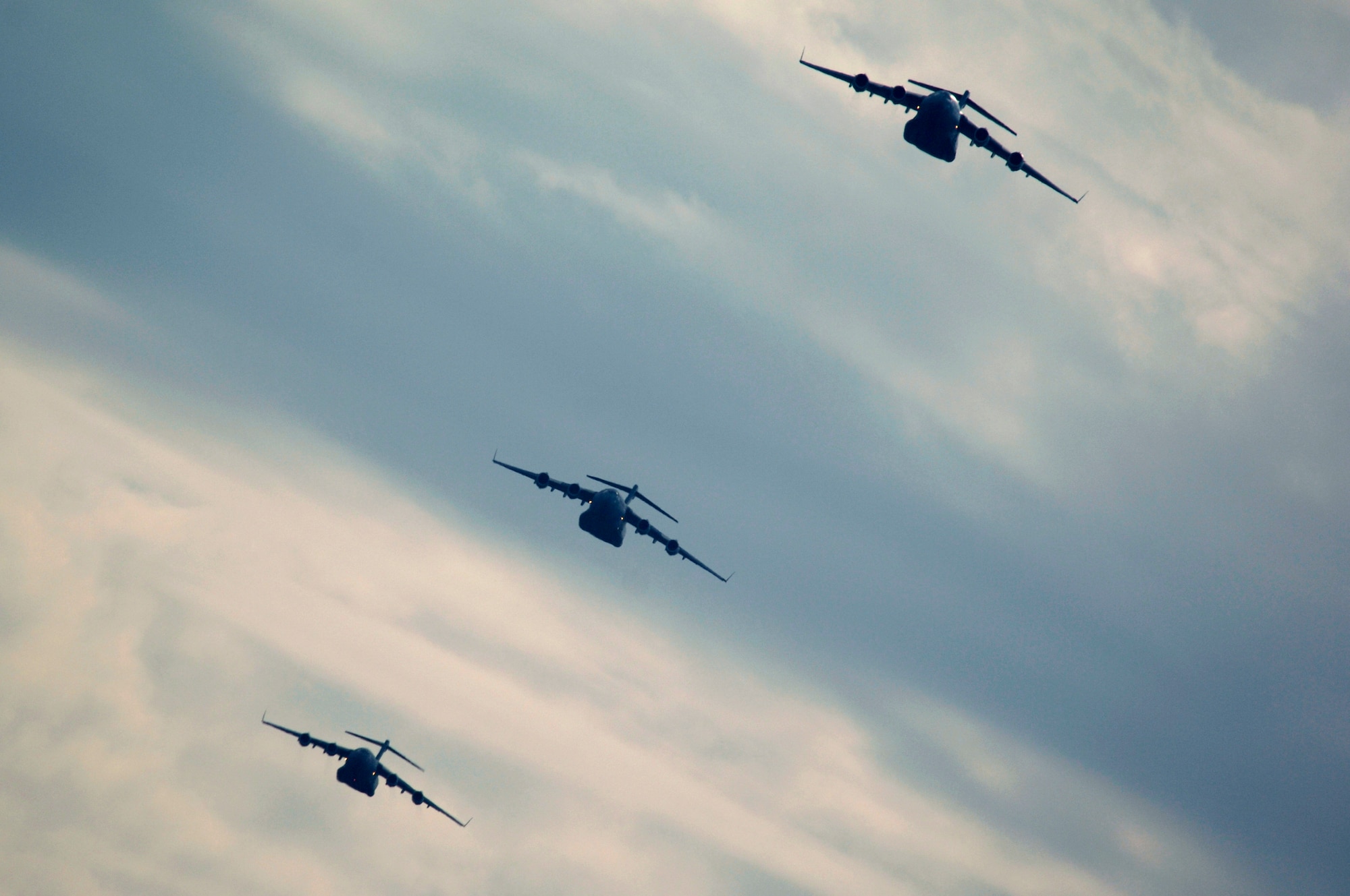 Several C-17 Globemaster IIIs fly as part of a 20-ship formation Dec. 21 over Charleston Air Force Base, S.C. The C-17s, assigned to the 437th and 315th Airlift Wings at Charleston AFB,  were part of the largest formation in history from a single base and demonstrated the strategic airdrop capability of the Air Force. (U.S. Air Force photo by Tech. Sgt. Adrian Cadiz)
