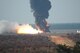 Fire and smoke fill the air as a Ground-based Midcourse Defense Ground-Based Interceptor Stage 1 Orbital Boost Vehicle motor burns during a fast cook-off test on Eglin’s range. (Air Force photo by Staff Sgt. Ryan Hansen)