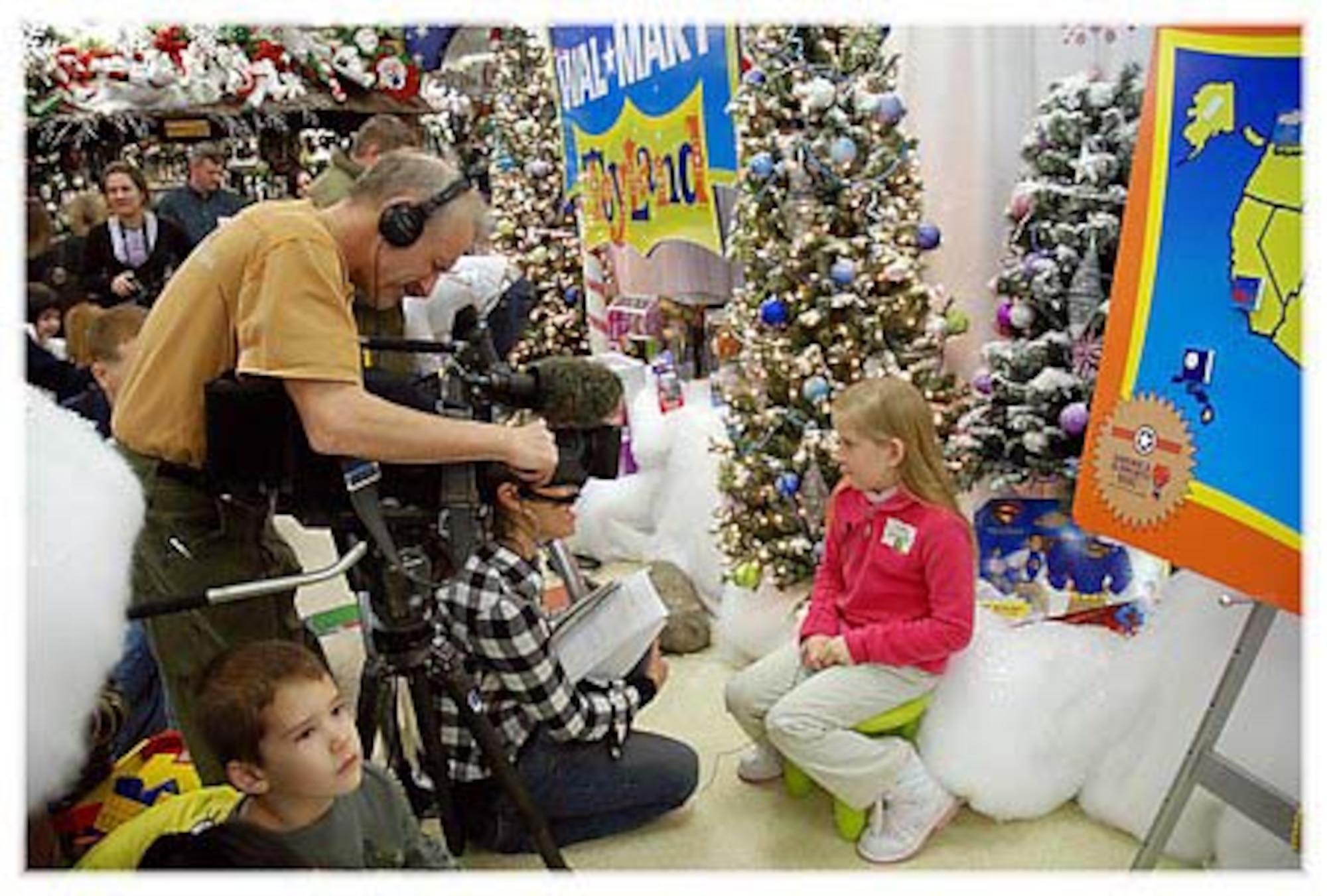 Sydney Spillane, 8, daughter of Senior Master Sgt. John Spillane, 29th Weapons School superintendent, talks on camera to television reporters during her trip to North Pole, Alaska, recently. Sydney and her parents, Tanya and Sergeant Spillane, won a trip to Santa's workshop and the first-ever "Top of the World Toy Summit" to test this year's hottest toys and visit with Santa. (Photo by Tanya Spillane)