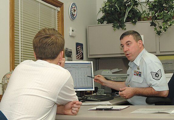 SPRINGFIELD, Mo. -- Then Tech.. Sgt., now Master Sgt., Jerry Hancock, an Air Force Reserve recruiter with the 442nd Fighter Wing at Whiteman Air Force Base, Mo., points out Reserve benefits to a potential 442nd Fighter Wing recruit.  Sergeant Hancock and recruiting team mate, Tech. Sgt. Ryan Noorlander, earned top Air Force Reserve Command recruiting awards in November. US Air Force photo / Master Sgt. Bill Huntington
