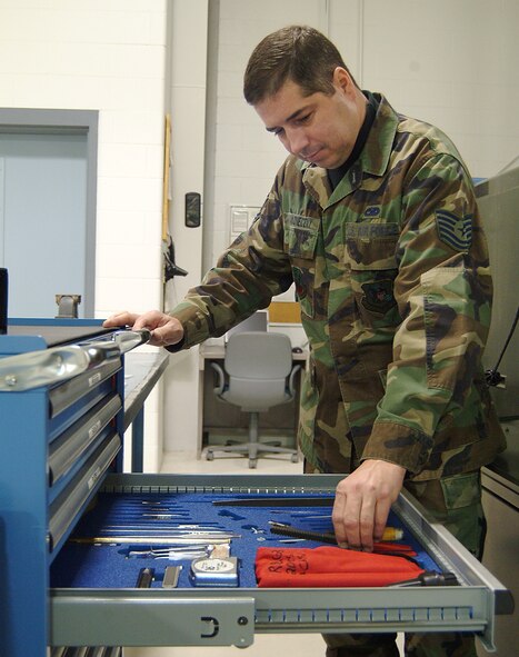 WHITEMAN AFB, Mo. -- Tech. Sgt. Robert Nakoneczny, an Aerospace Ground Equipment technician with the 442nd Maintenance Squadron and an Air Force reservist, here, selects the right tool for the job as he repairs AGE equipment in the 442nd MXS AGE shop. US Air Force photo / Master Sgt. Bill Huntington