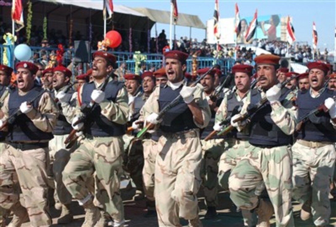 Iraqi army soldiers participate in a parade during a handover ceremony in Najaf, Iraq, Dec. 20, 2006. U.S.-led forces transitioned control and security responsibilities of Najaf province to the Iraqi forces.