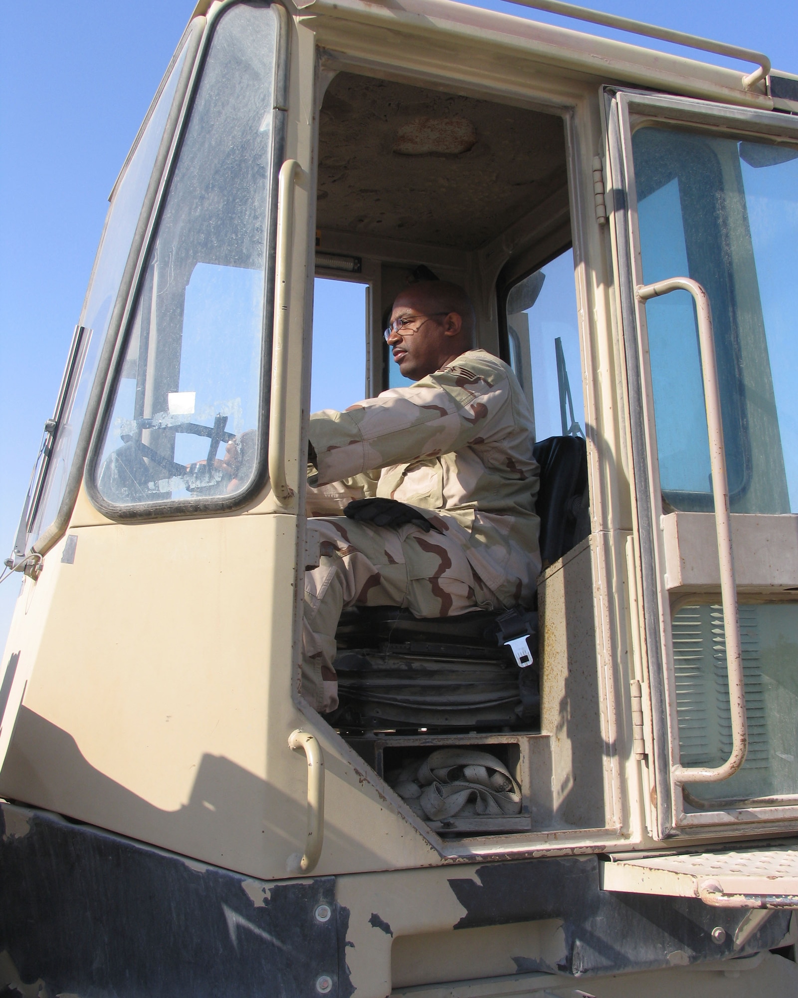 Senior Airman Douglas Hicks operates a 10,000-pound forklift. Airman Hicks is an air transportation journeyman assigned to the 386th Expeditionary Logistics Readiness Squadron in Southwest Asia, where his duties include configuring aircraft for cargo and personnel transport and providing safety briefings to his team members prior to the start of his shift. He is serving on his first deployment from Dobbins Air Reserve Base, Ga. (U.S. Air Force photo/Staff Sgt. Ian Carrier)