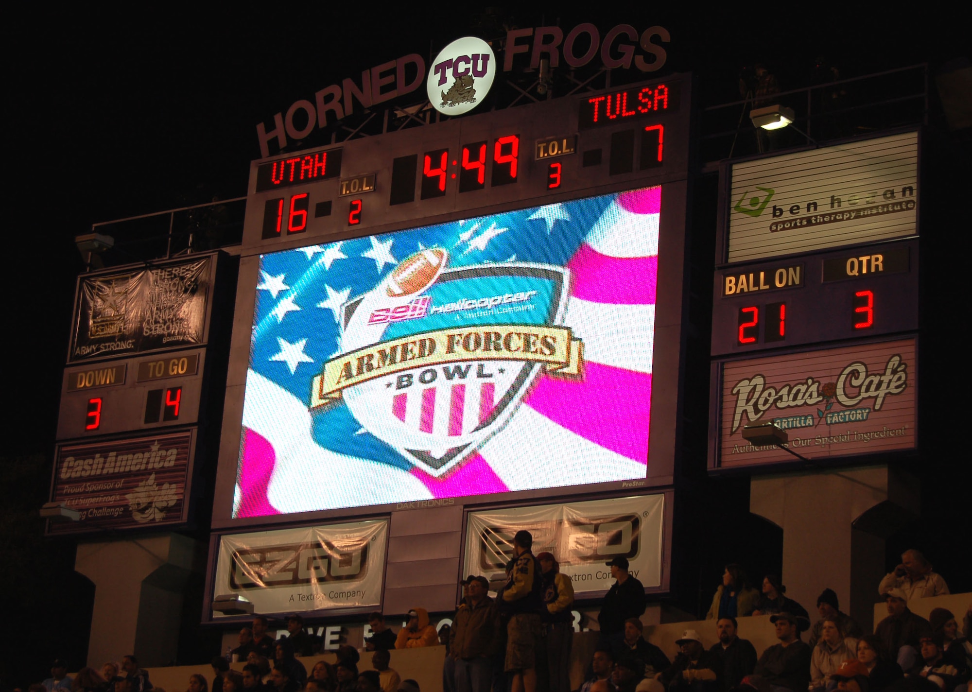 The logo for the Bell Helicopter Armed Forces Bowl is shown on the scoreboard at Amon G. Carter Stadium in Fort Worth, Texas, Dec. 23. The Bell Helicopter Armed Forces Bowl is an event in partnership with America Supports You, a Department of Defense program that showcases American support for members of the armed forces. The University of Utah Utes defeated the Golden Hurricanes of the University of Tulsa, 25-13. (U.S. Air Force photo/Annette Crawford)