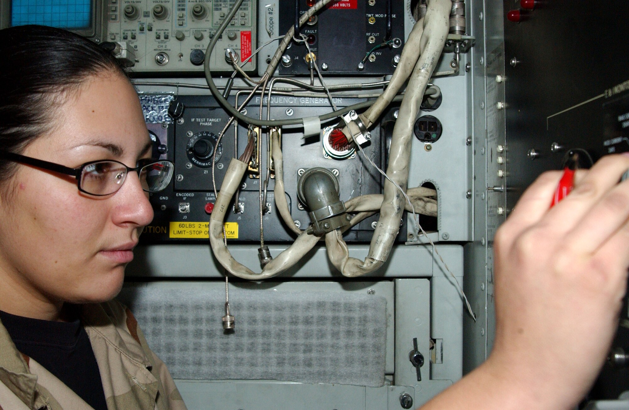 Senior Airman Adrienne Samora conducts a daily preventative maintenance inspection Dec. 19 on one of the ground radar systems at Balad Air Base, Iraq. Airman Samora, a 727th Expeditionary Air Control Squadron radar maintenance technician, is deployed from Mountain Home Air Force Base, Idaho. (U.S. Air Force photo/Staff Sgt. Alice Moore) 