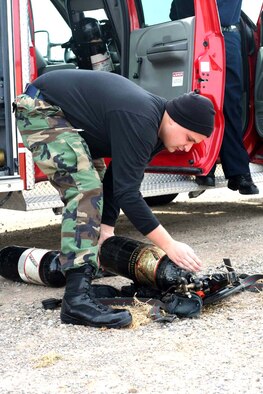 Staff Sgt. Christopher Seeley prepares his gear before the shuttle convoy from Holloman Air Force Base, N.M., heads out to the alternate landing site Dec. 22 to support the possible landing there of the Space Shuttle Discovery. Airmen from Holloman are ready to support all NASA missions by training numerous times a year for such an event.  Sergeant Seeley is assigned to the 49th Civil Engineer Squadron. (U.S. Air Force photo/Airman 1st Class Heather Stanton) 