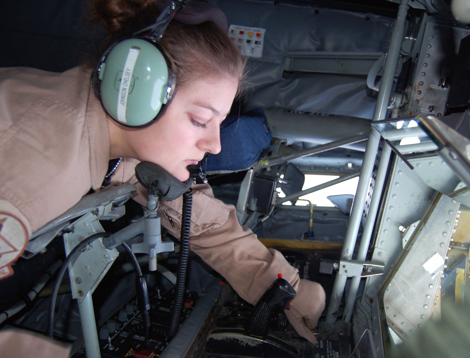 Senior Airman Chelsey Johnson prepares the refueling boom in the back end of a KC-135 Stratotanker Christmas day for the arrival of a B-1B Lancer needing fuel.  The bomber received 39,000 pounds of fuel to continue its mission over the Afghanistan area of responsibility.  Airman Johnson is a 22nd Expeditionary Air Refueling Squadron boom operator deployed to Manas Air Base, Kyrgyzstan, from the 92 ARS at Fairchild Air Force Base, Wash. (U.S. Air Force photo/Master Sgt. Mitch Gettle) 