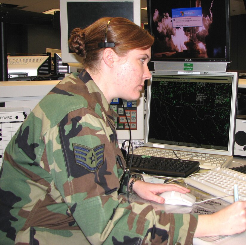 Staff Sgt. Lara Koler tracks radar targets at the Western Air Defense Sector at McChord Air Force Base, Wash.  A native of Eugene, Ore., Sergeant Koler is an identification technician who will spend this holiday season identifying "tracks of interest," unknown radar blips in the Western U.S. air space, on her radar screen. (U.S. Air Force photo/Randy Rubattino)