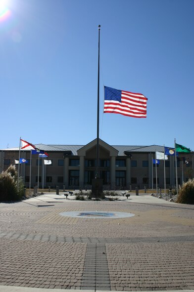 LAUGHLIN AFB, TEXAS -- Blowing in the breeze, the flag outside the 47th Flying Training Wing headquarters hangs at half-staff in remembrance of President Gerald R. Ford, the thirty-eighth president of the United States.  (U.S. Air Force photo by 2nd Lt. Courtney Kippenberger) 
