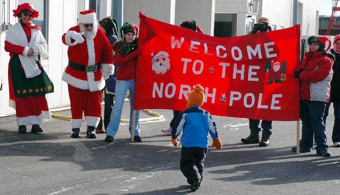 A young passenger arrives at the "North Pole" courtesy of the 934th Airlift Wing and one of its' C-130s.  (US Air Force Photo/Paul Zadach)