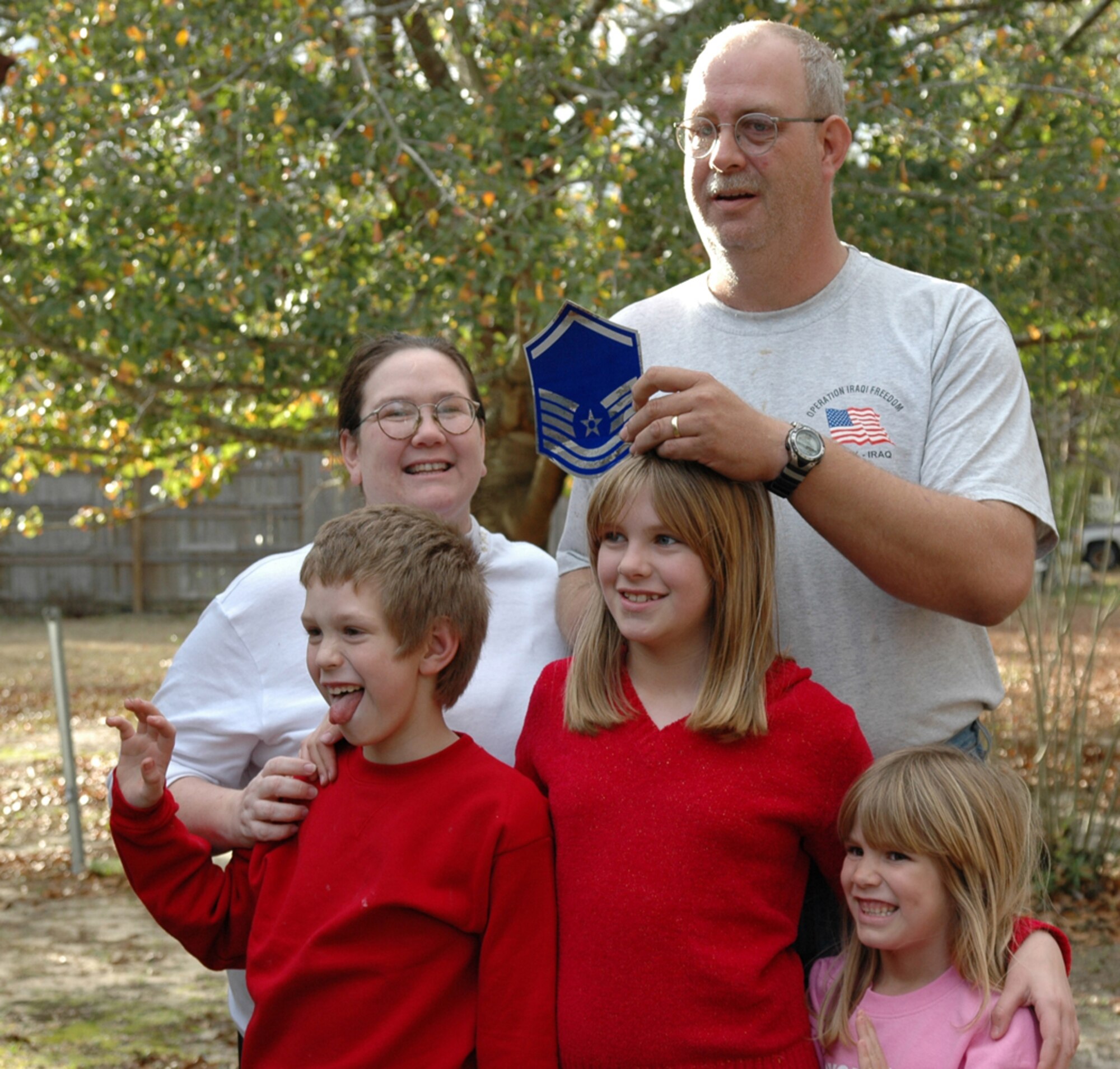EGLIN AIR FORCE BASE, Fla. -- Tech. Sgt Mike Wisenbaker, 33d Maintenance Squadron received master sergeant stripes for Christmas.  His wife Becky and children Kathryn, 10, Brandon, 8 and Patricia, 6, were all surprise at the at the Stripes for Exceptional Performers promotion Col. Russ Handy, 33d Fighter Wing Commander presented Sergeant Wisenbaker Monday at their home in Crestview, Fla.

