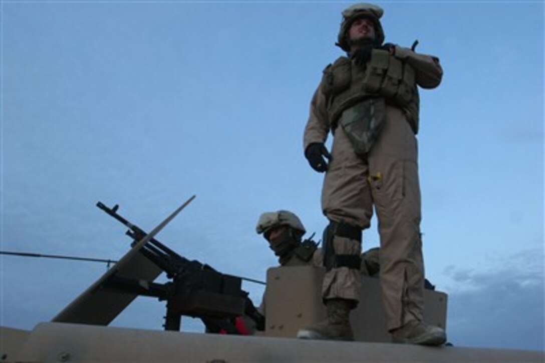 U.S. Marines of Marine Wing Support Squadron 273 prepare to depart for a recovery mission of a CH-53E Super Stallion helicopter in Al Asad, Iraq, on Dec. 13, 2006.  