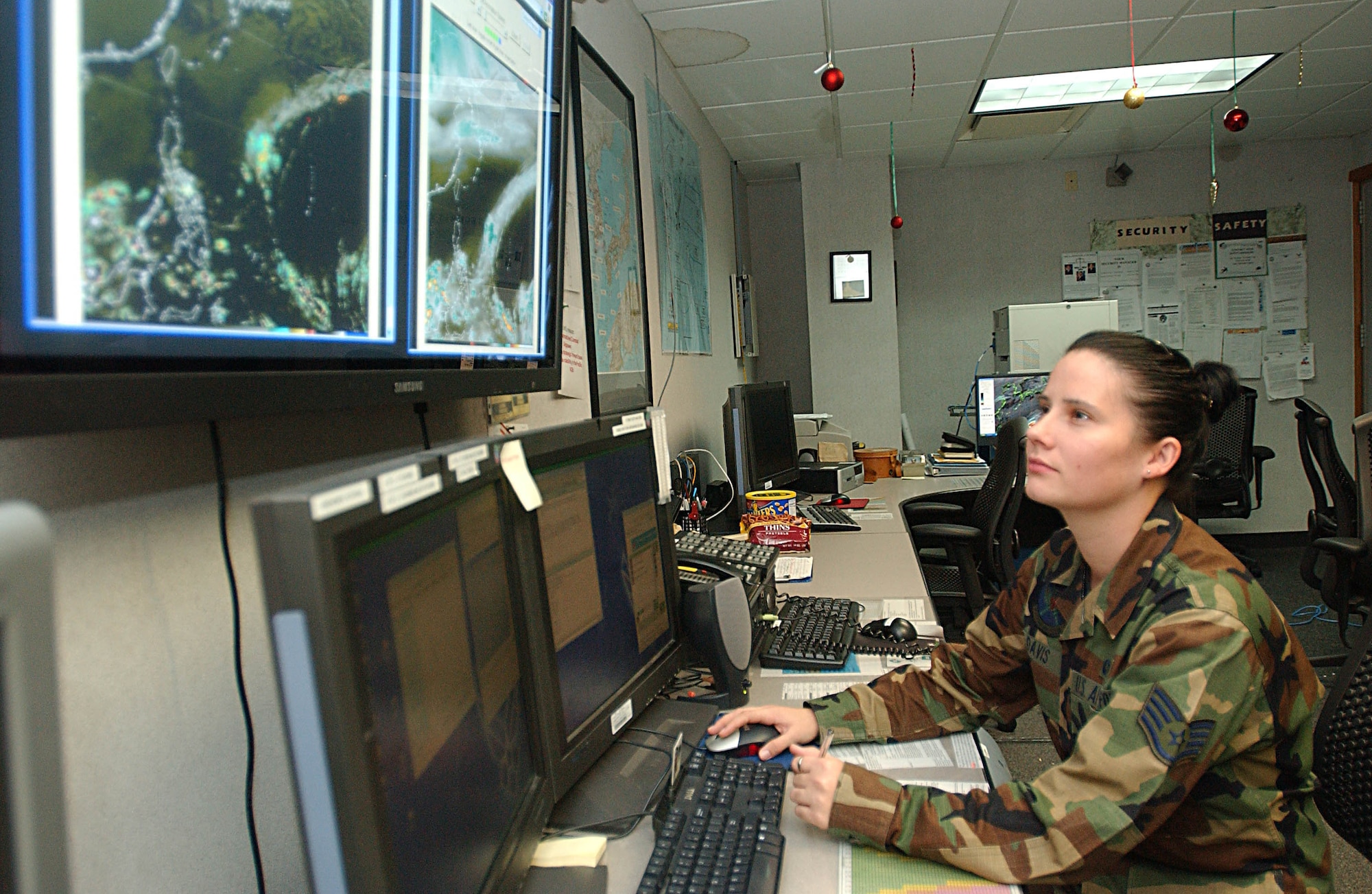 Staff Sgt. Kyna Davis, 18th Operations Support Squadron meteorologist, reviews the weather radar at Kadena Air Base, Japan.  Sergeant Davis is one of many Airmen on duty this holiday season.  (U.S. Air Force photo/Airman 1st Class Sheila DeVera)                            